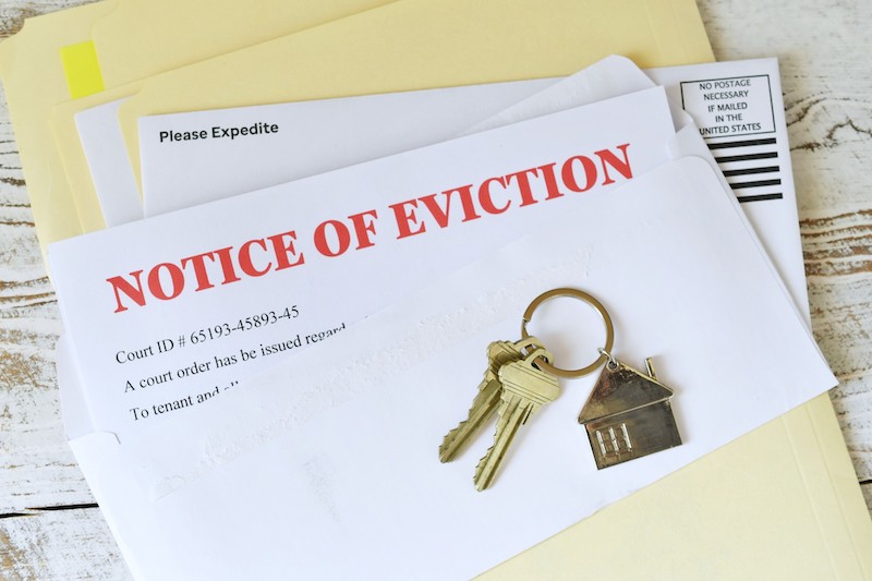 Set of house keys on eviction notice
