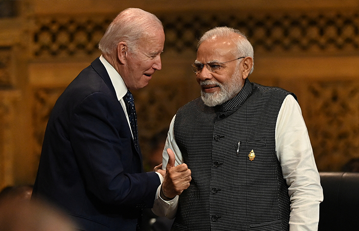 Joe Biden speaks with Prime Minister of India Narendra Modi at the G20 Summit opening session in Nusa Dua, Bali, Indonesia, Tuesday, Nov. 15, 2022.
