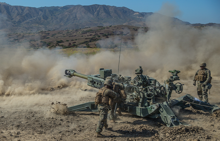 U.S. Marines with Mike Battery, 3rd Battalion, 11th Marine Regiment, 1st Marine Division, fire an M777 Howitzer during Fire Exercise (FIREX) 19 at Marine Corps Base Camp Pendleton, California, July 26, 2019. FIREX 19 is a regimental-level exercise designed to improve internal standard operating procedures and allow multiple batteries to train together in preparation for Steel Knight, an annual combat readiness exercise. (U.S. Marine Corps photo by Lance Cpl. Ana S. Madrigal)