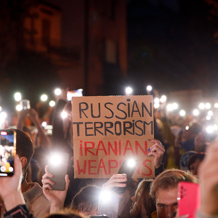 Protesters hold up their phones with flashlights lit during a protest in Warsaw, Poland on 17 October, 2022.