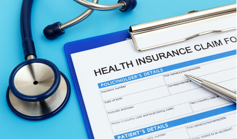 health insurance form and stethoscope