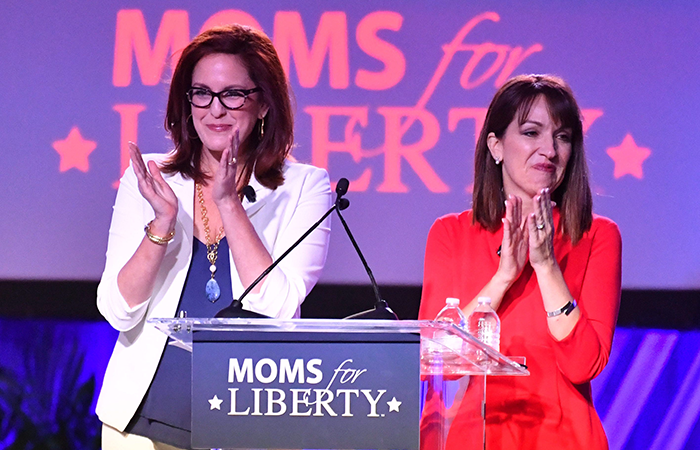 Moms for Liberty co-founders Tiffany Justice, left, and Tina Descovich, greet attendees as they open the first Moms for Liberty National Summit on Thursday, July 15, 2022 in Tampa, Florida.