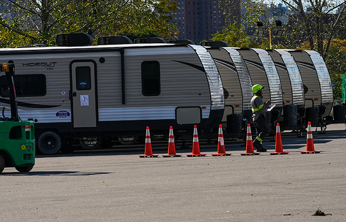 Tent shelters built on New York City's Randall's Island for recently arrived migrants stand in an open lot in New York City.
