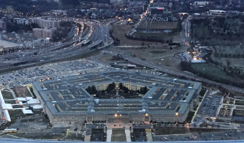 a passanger in a commercial airline departing Reagan International Airport outside Washington, DC captures a dusk-time picture of The Pentaon from the airpla e