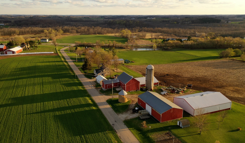 Aerial shot of farm buildings and fields